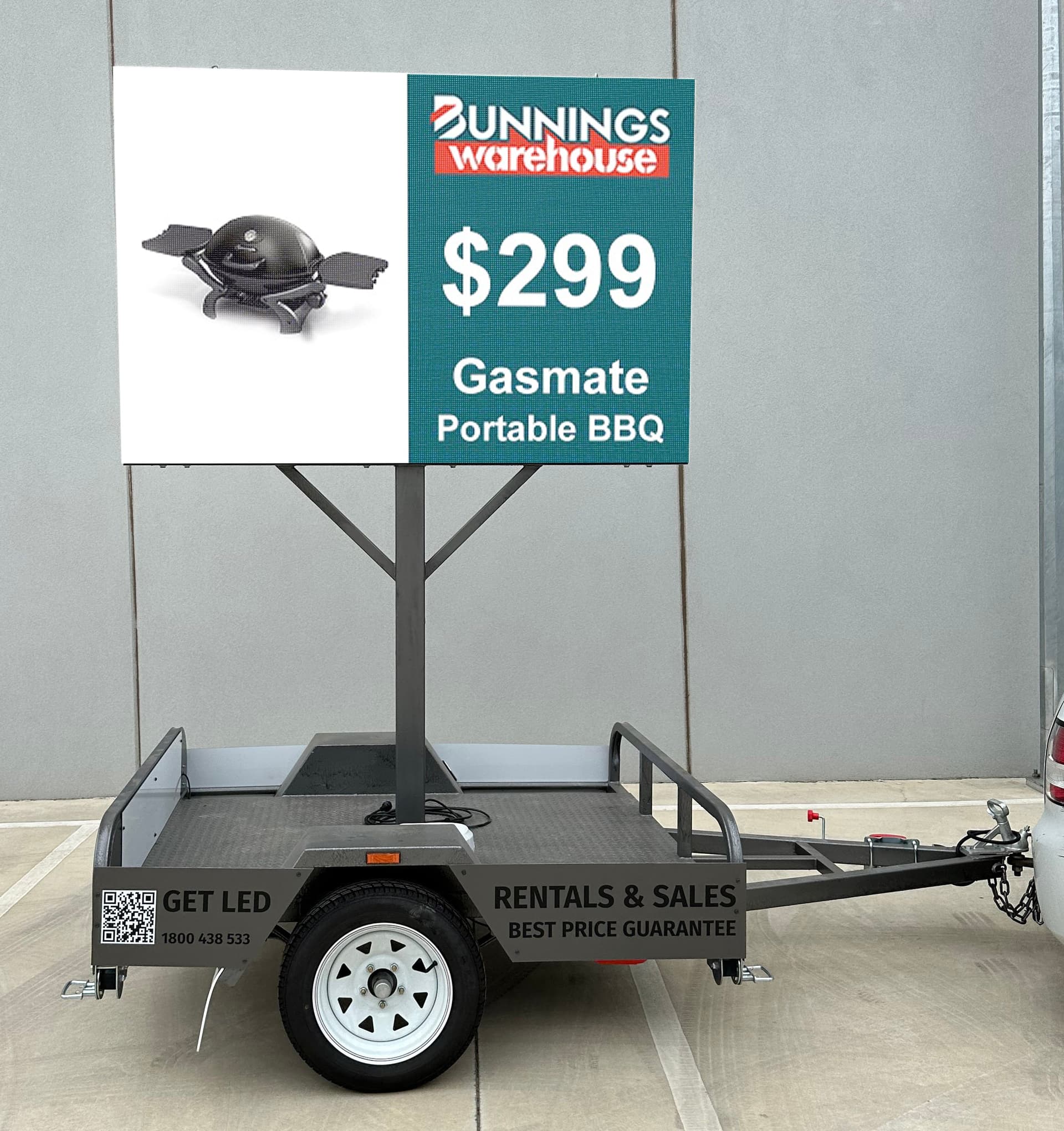 An LED trailer: a full-colour LED screen raised on a mast above a single-axle trailer