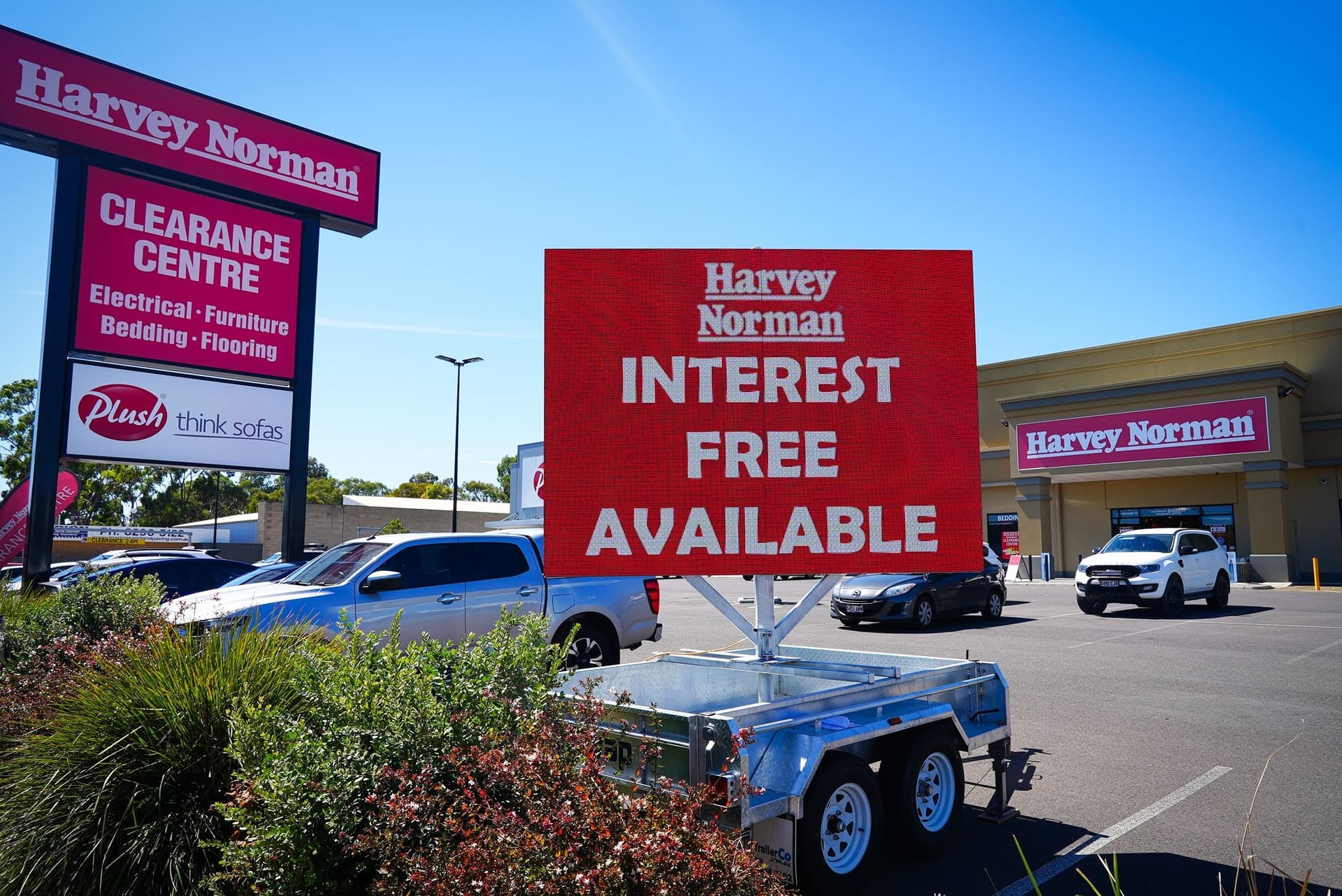 LED trailer in a car park outside an electrical store, showing an interest-free offer.